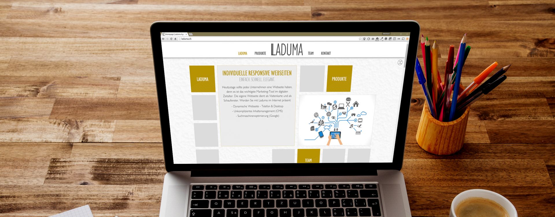 Ladumas Webseite auf einem Laptop dargestellt